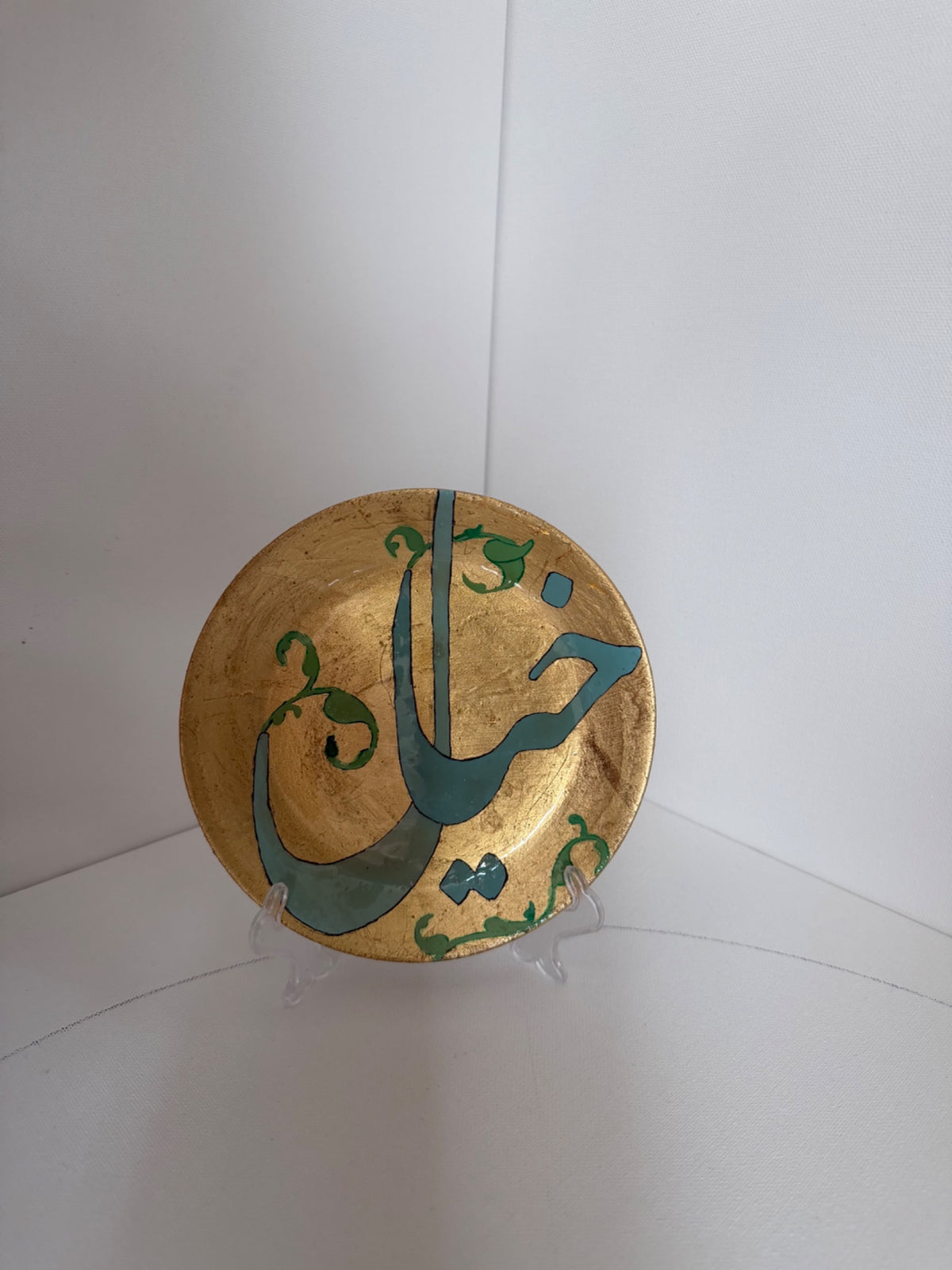 Gold Verse Plate — gold plate with flowing teal Persian calligraphy